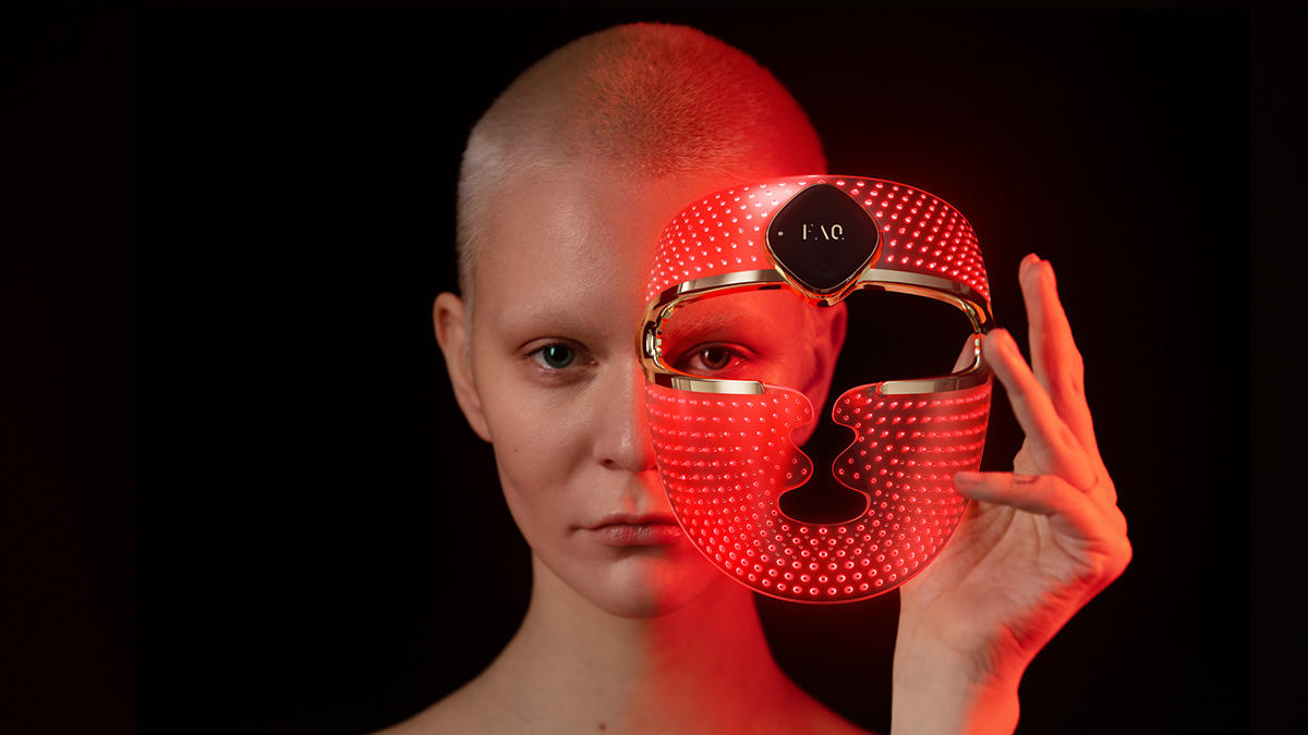 HigherDOSE Red Light Face Mask glowing on model